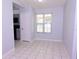 A well-lit dining area features tile flooring and a view from a window that allows for ample natural light at 4235 W Vista Ct, Kissimmee, FL 34746