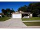 Attractive one-story house featuring an attached garage and inviting front porch at 4235 W Vista Ct, Kissimmee, FL 34746