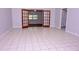 Bright living room featuring tile floors, neutral paint, and French doors at 4235 W Vista Ct, Kissimmee, FL 34746