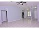 Spacious living room with neutral color walls, recessed lighting, and tile flooring at 4235 W Vista Ct, Kissimmee, FL 34746