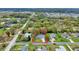 Aerial view of a charming neighborhood featuring a treed landscape, and comfortable living at 4884 Meadow Dr, St Cloud, FL 34772