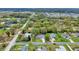Aerial view of a charming neighborhood featuring a treed landscape, and comfortable living at 4884 Meadow Dr, St Cloud, FL 34772