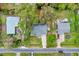 Aerial view of a charming neighborhood featuring a treed landscape, and comfortable living at 4884 Meadow Dr, St Cloud, FL 34772