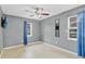 This bedroom offers natural light, ceiling fan, and tile floors at 4884 Meadow Dr, St Cloud, FL 34772