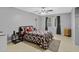 The bedroom features neutral walls, tile flooring, ceiling fan, and natural light at 4884 Meadow Dr, St Cloud, FL 34772