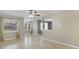 Living room with tile flooring, open layout, and abundant natural light from the windows at 4884 Meadow Dr, St Cloud, FL 34772