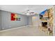 Living room with tile flooring, stone fireplace, and accent artwork at 4884 Meadow Dr, St Cloud, FL 34772