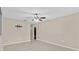 A view of the living room with tile floors and ceiling fan at 4884 Meadow Dr, St Cloud, FL 34772