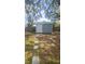 Backyard storage shed with a modern design provides additional space for tools and equipment at 4884 Meadow Dr, St Cloud, FL 34772