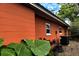 View of the home's exterior, showcasing the siding, windows, and air conditioning unit at 5019 Saint Germain Ave, Belle Isle, FL 32812