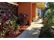 Close up view of a landscaped walkway leading up to the home's front entrance at 5019 Saint Germain Ave, Orlando, FL 32812