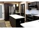 Stylish kitchen with modern appliances, white countertops, and custom cabinetry for organized storage at 5019 Saint Germain Ave, Orlando, FL 32812