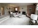 Cozy living room with a fireplace, comfortable seating, and an inviting atmosphere for relaxation at 5019 Saint Germain Ave, Orlando, FL 32812