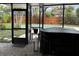 View of screened-in lanai with hot tub, overlooking the pool and backyard at 5019 Saint Germain Ave, Orlando, FL 32812
