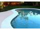Close-up of a beautifully maintained pool with clear blue water and clean tile work at 5019 Saint Germain Ave, Orlando, FL 32812