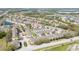 Scenic aerial view showcases community layout including pools, landscaping, and resident parking at 521 Pacito Way, St Cloud, FL 34769