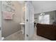 Convenient half-bathroom with pedestal sink is located off the main living area at 521 Pacito Way, St Cloud, FL 34769