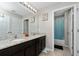 Well-lit bathroom features dual sinks, granite counters, and a shower/tub combo at 521 Pacito Way, St Cloud, FL 34769