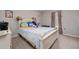 Comfortable bedroom featuring a white bed frame, soft bedding, and colorful decorations at 521 Pacito Way, St Cloud, FL 34769