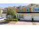 Charming townhome with a brick driveway and a one-car garage at 521 Pacito Way, St Cloud, FL 34769
