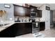 Well-equipped kitchen with granite countertops and stainless steel appliances at 521 Pacito Way, St Cloud, FL 34769