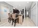 Kitchen island with bar seating, offering a view of the modern kitchen at 521 Pacito Way, St Cloud, FL 34769