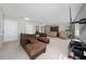 Spacious upstairs bonus living area with sofas, a large TV and comfortable seating at 521 Pacito Way, St Cloud, FL 34769