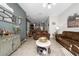 Inviting living room featuring tile floors, cozy couches and an open floor plan to the kitchen at 521 Pacito Way, St Cloud, FL 34769