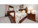 Spacious main bedroom featuring a large bed, a dresser and a large window for natural light at 521 Pacito Way, St Cloud, FL 34769