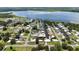 Waterfront home with dock and lush landscaping, nestled within a tranquil canal community and near a scenic lake at 534 Minnow Ct, Kenansville, FL 34739