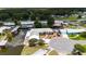 Waterfront home with private dock on a canal, featuring a metal roof and well-maintained landscaping in a quiet neighborhood at 534 Minnow Ct, Kenansville, FL 34739