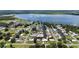 Waterfront home with dock and lush landscaping, nestled within a tranquil canal community and near a scenic lake at 534 Minnow Ct, Kenansville, FL 34739