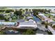 Aerial view showcases a waterfront home with canal access and nearby lake at 534 Minnow Ct, Kenansville, FL 34739