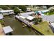 Waterfront home with boat dock and lush landscaping offers tranquil setting and convenient canal access at 534 Minnow Ct, Kenansville, FL 34739