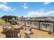 Backyard patio with outdoor seating and a fire pit perfect for entertaining by the water at 534 Minnow Ct, Kenansville, FL 34739