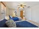 Well-lit bedroom with twin beds, tile flooring, ceiling fan, and closet at 534 Minnow Ct, Kenansville, FL 34739