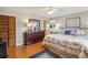 Spacious bedroom with hardwood floors, closet space and view of ensuite bathroom at 534 Minnow Ct, Kenansville, FL 34739
