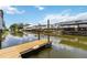 Wooden dock extending into the canal, offering waterfront access at 534 Minnow Ct, Kenansville, FL 34739