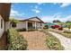 Charming home with a welcoming front porch, manicured landscaping, and a paved walkway at 534 Minnow Ct, Kenansville, FL 34739