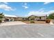 Well-kept home with a large driveway, carport, and tropical landscaping showcases curb appeal at 534 Minnow Ct, Kenansville, FL 34739