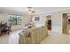 Bright living room with tile floors, crown molding, and a view of the backyard at 534 Minnow Ct, Kenansville, FL 34739