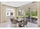 Dining area with large sliding glass doors that lead to an outdoor patio at 5453 Catmint Dr, Lake Hamilton, FL 33851