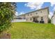 Large backyard with a well-maintained lawn and white vinyl fence at 5685 Surprise Lily Dr, Winter Garden, FL 34787