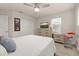 Bright bedroom featuring a ceiling fan, large closet, television, and modern furnishings at 5685 Surprise Lily Dr, Winter Garden, FL 34787