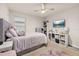 Inviting bedroom featuring a ceiling fan, television, and decor at 5685 Surprise Lily Dr, Winter Garden, FL 34787