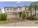 Charming two-story home featuring a two car garage and beautifully landscaped yard at 5685 Surprise Lily Dr, Winter Garden, FL 34787