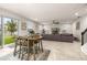 Spacious living room with a dining area, large sectional sofa, and backyard access at 5685 Surprise Lily Dr, Winter Garden, FL 34787