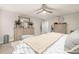 The large main bedroom features ample space, neutral colors, and a decorative dresser with mirror at 5685 Surprise Lily Dr, Winter Garden, FL 34787
