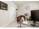 Functional office space with a glass desk, comfortable seating, and plenty of natural light at 5685 Surprise Lily Dr, Winter Garden, FL 34787