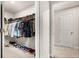 Walk-in closet featuring ample hanging space and shoe storage at 5685 Surprise Lily Dr, Winter Garden, FL 34787